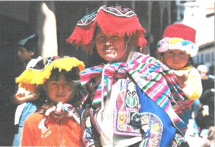 The people of Peru still wear their native dress, whether marketing in town or working the fields.  Their type of hat denotes what region they are from.